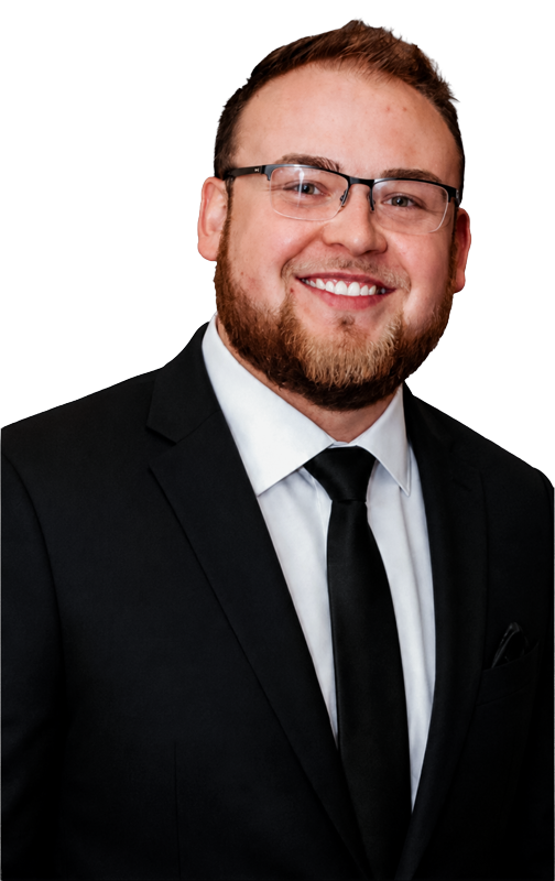 Kyle-Jewell-Sales-Agent-Posing-For-Professional-Portrait-Wearing-a-black-suite-and-tie